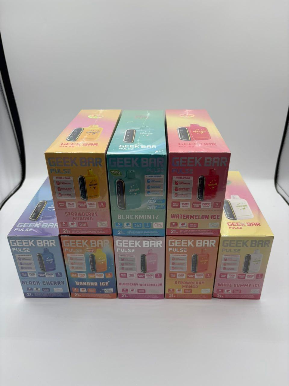 Close up of a red Geek Bar Pulse Watermelon Ice disposable vape sitting next to its original packaging showing the LED display screen Close up of a red Geek Bar Pulse Watermelon Ice disposable vape sitting next to its original packaging showing the LED display screen