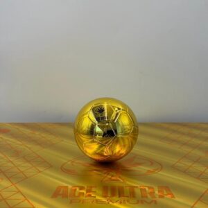 Close-up of the golden Ace Ultra Premium World Cup Edition vape hardware featuring a clear mouthpiece cap and a black band with FIFA20 text.