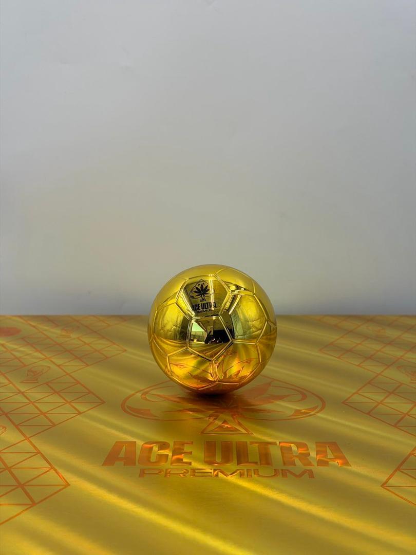 Close-up of the golden Ace Ultra Premium World Cup Edition vape hardware featuring a clear mouthpiece cap and a black band with FIFA20 text.
